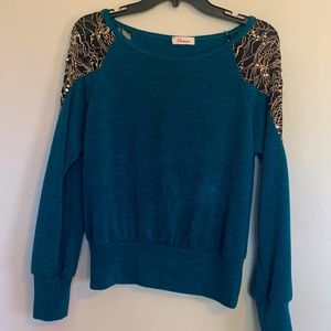 Green blouse with sequence around shoulder